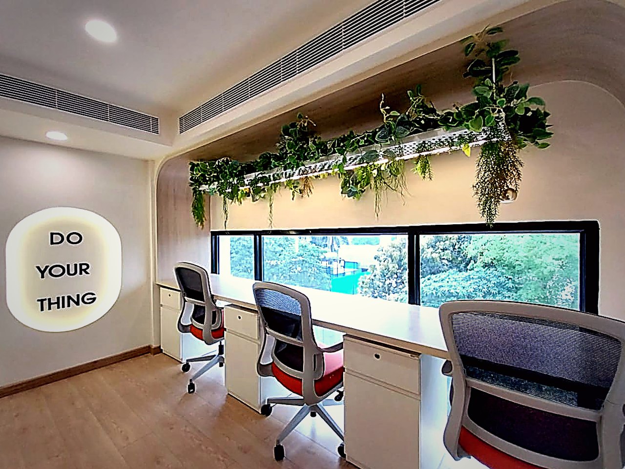 Hot desks by the window — Worksiva Gurugram